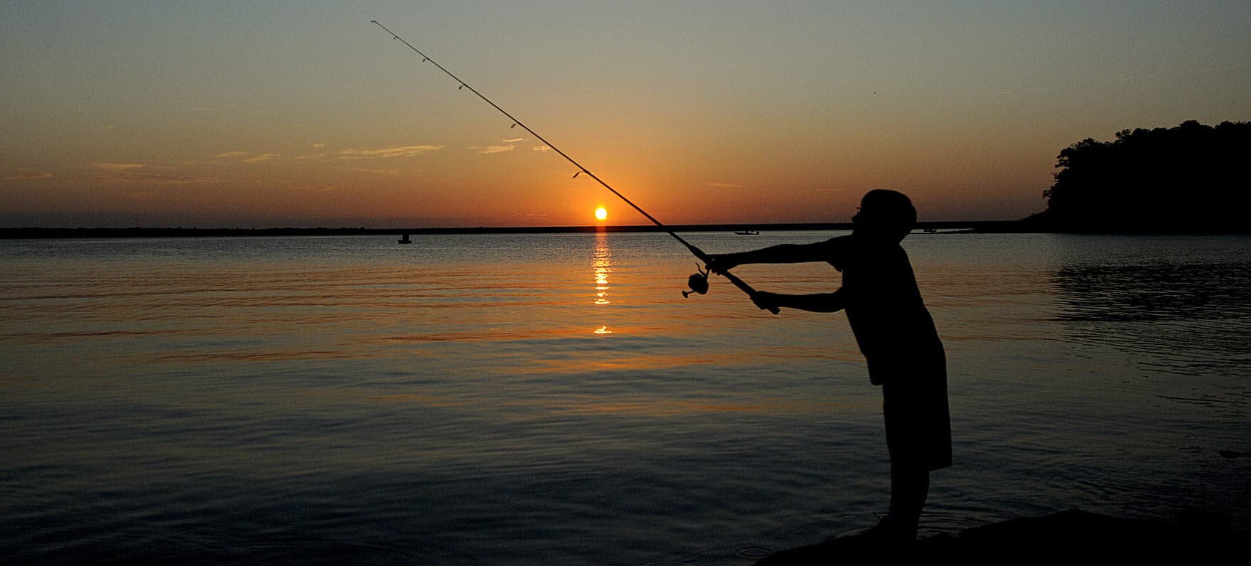 Silhouette of Boy Fishing at Eisenhower